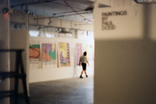 Installation view of Paul Dodd "World Record Holders" 1989 Pyramid Arts Center. Director, Larry Champoux in foreground.