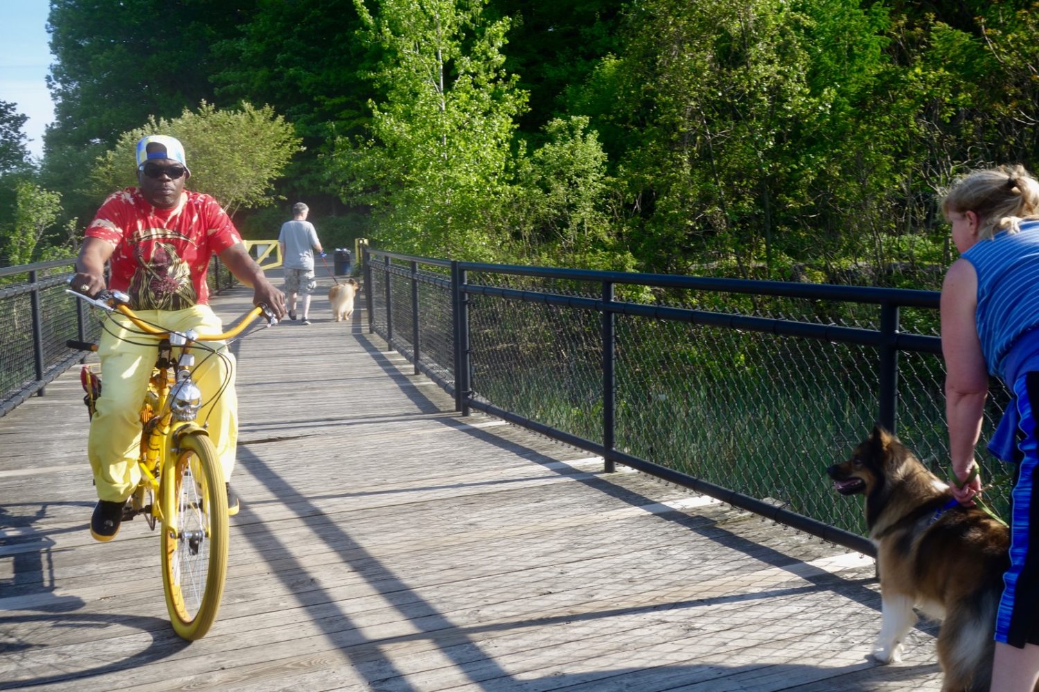 Man on yellow bike at Turning Point Park in Rochester, New York