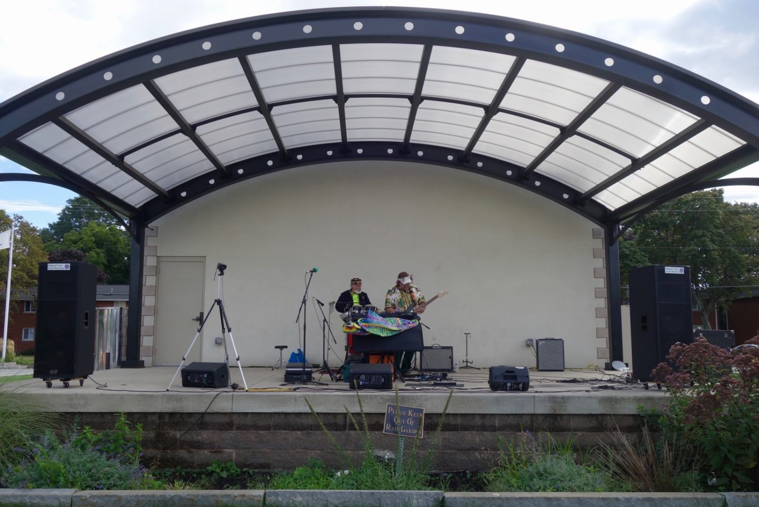 Cosmic Meditation performing live outdoors next to the House of Guitars in Rochester, New York