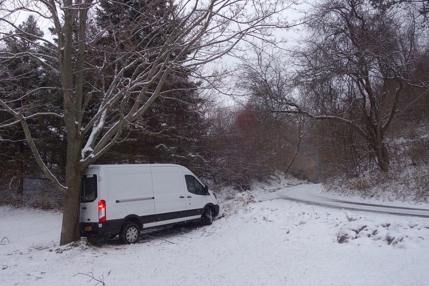 Delivery truck stuck in the snow on Rainbow Drive