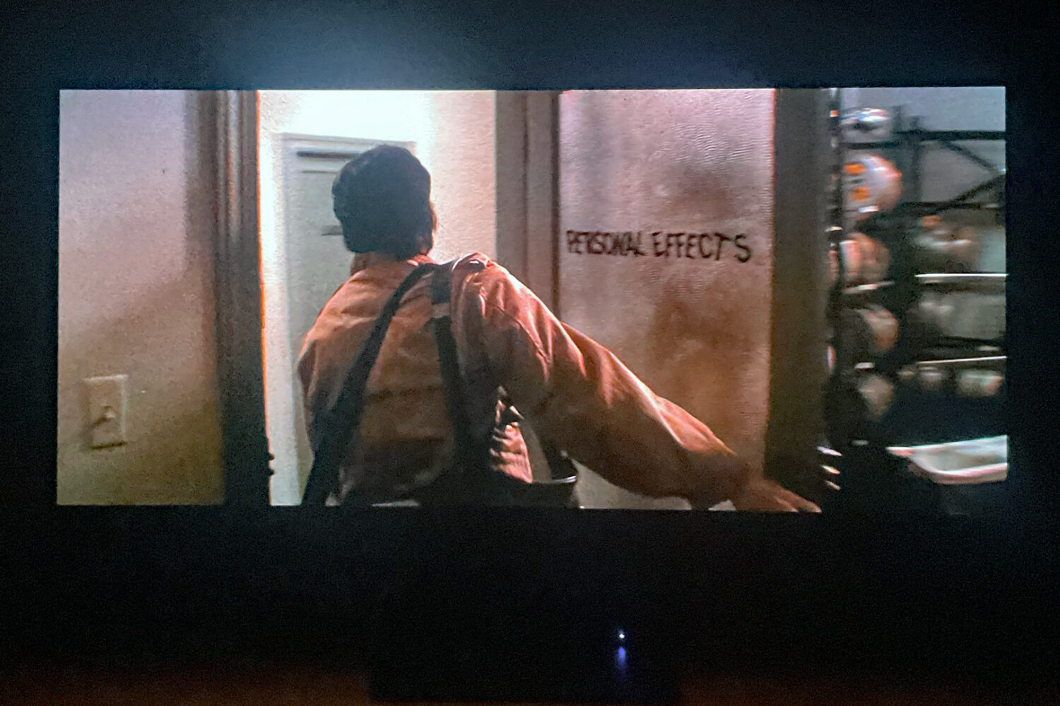 John Travolta in John Carpenter's "Blow Out." Personal Effects is the name of his video company.