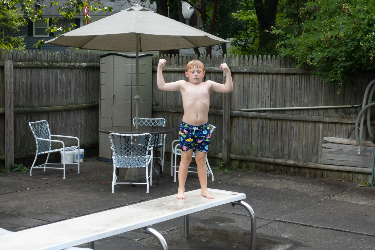 Walker as strongman on diving board