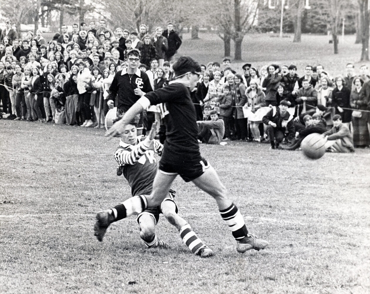 CHARGING IN-Ted Goglin of Gates Chili, left, and Frank Mastowski of Webster charge at loose ball in first half of sectional soccer game won by Gates Chili, 1-0. D&C Photo by Pat Crowe